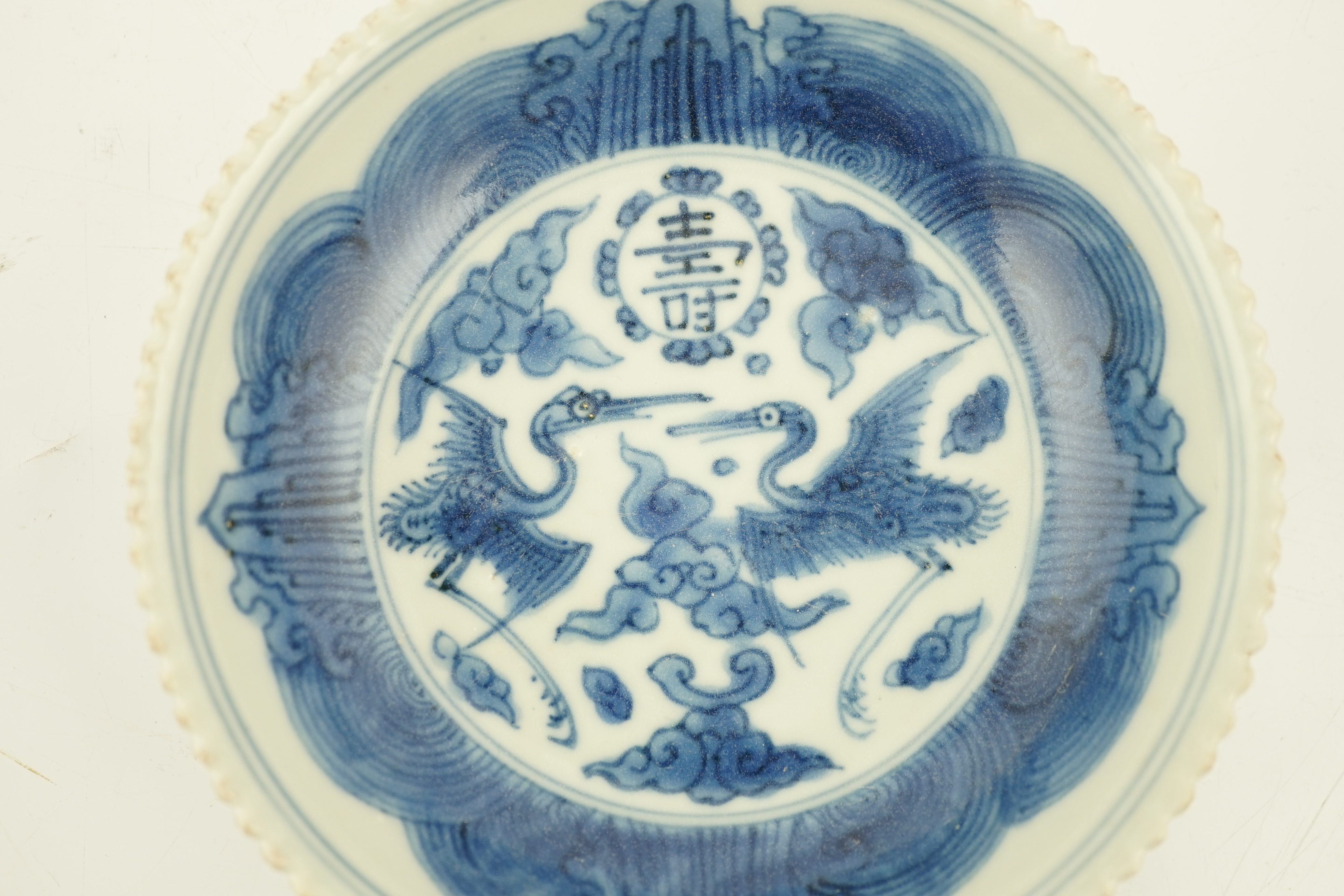 A Chinese blue and white ‘phoenix’ saucer dish, Jiajing mark and probably of the period